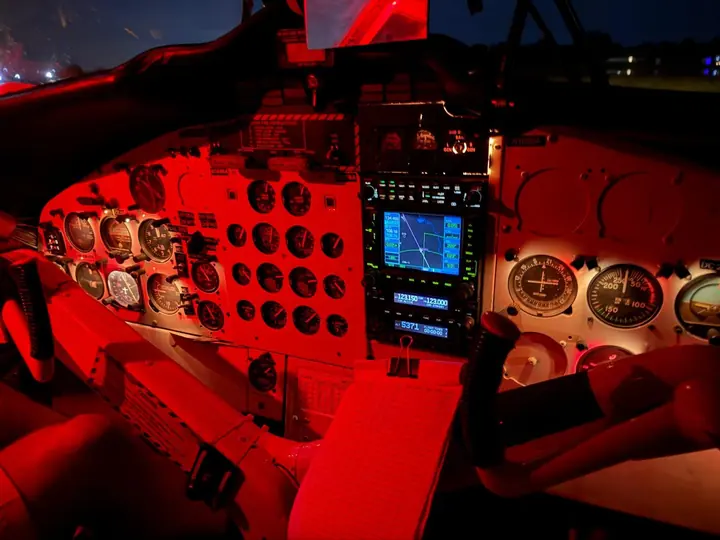 Night jump: Red cockpit lights on the climb