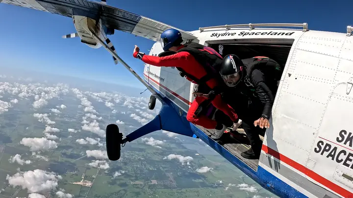 Exit: Climbing out at Skydive Spaceland